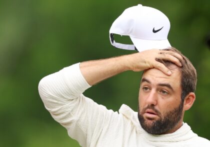Top-ranked new father Scottie Scheffler reacts to a shot on the second hole during a pract