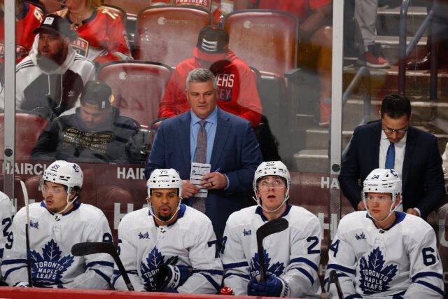 Toronto Maple Leafs head coach Sheldon Keefe, center, was fired by the NHL club after the