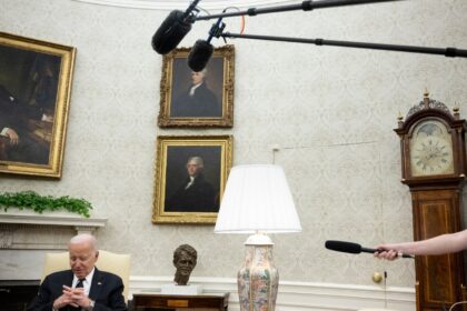US President Joe Biden listens during a meeting with Romanian President Klaus Iohannis (ou