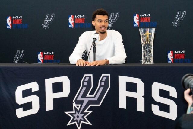 Victor Wembanyama talks to reporters after he was presented with his NBA Rookie of the Yea