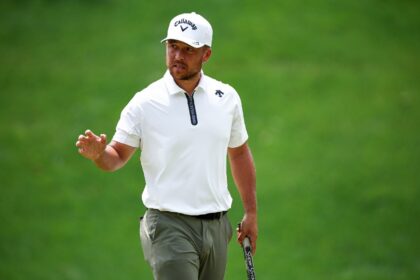 Xander Schauffele fired a four-under par 67 to grab the lead at the storm-hit PGA Wells Fa