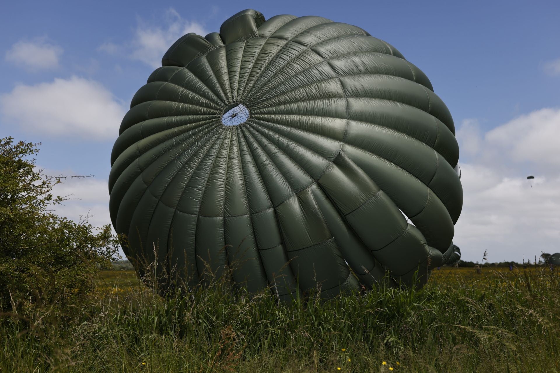 Parachute drop in Carentan-Les-Marais in Normandy, France on Sunday, June 02, 2024, ahead of D-Day 80th anniversary commemorations. (AP Photo/Jeremias Gonzalez)