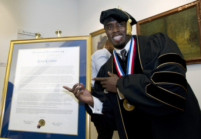 FILE - Entertainer and entrepreneur Sean Combs poses next to his honorary degree of Doctor