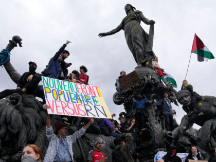 Protesters hold an anti-far right banner during a rally in Paris, Saturday, June 15, 2024.