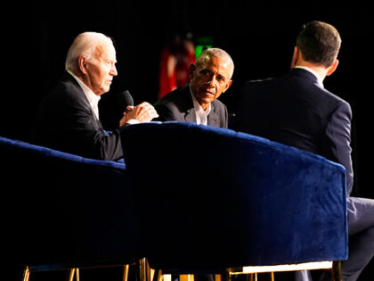 President Joe Biden speaks during a campaign event with former President Barack Obama mode