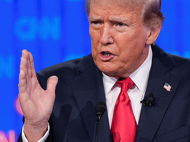 Republican presidential candidate former President Donald Trump gestures during a presiden