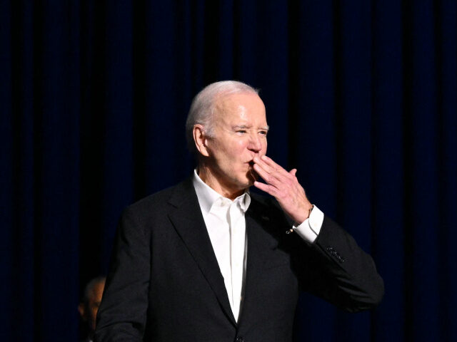 US President Joe Biden blows a kiss onstage during a campaign fundraiser at the Peacock Th
