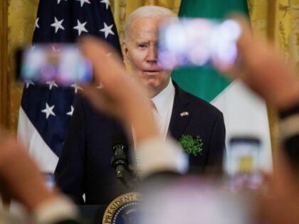 WASHINGTON, DC - MARCH 17: Guests hold up their cell phones as President Joe Biden and Iri