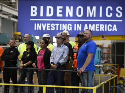 Employees listen to US President Joe Biden speak about Bidenomics in Milwaukee, Wisconsin,