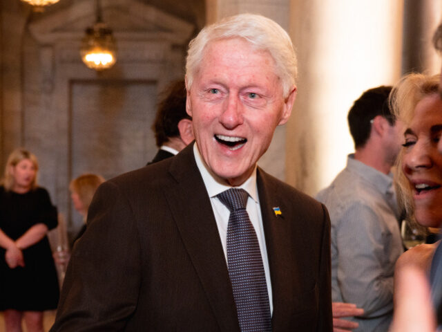 NEW YORK, NEW YORK - MAY 02: Former US President Bill Clinton greets guests at the launch