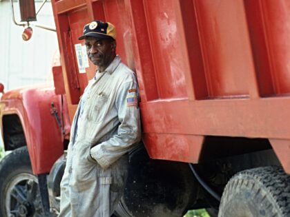 Bill Cobbs leaning on truck in a scene from the film 'Dominick And Eugene', 1988. (Photo b