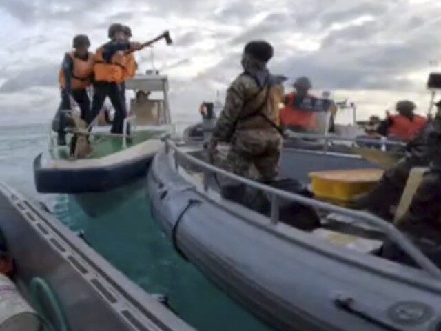 In this handout photo provided by Armed Forces of the Philippines, Chinese Coast Guards ho