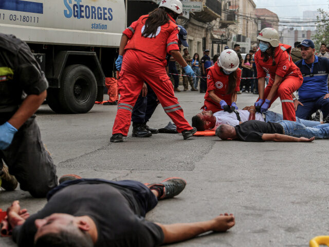 27 June 2024, Lebanon, Jounieh: Medics help civilians acting as dead and injured of an att