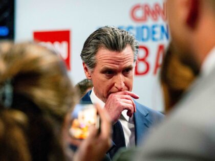 Gavin Newsom, governor of California, center, speaks to members of the media at the McCami