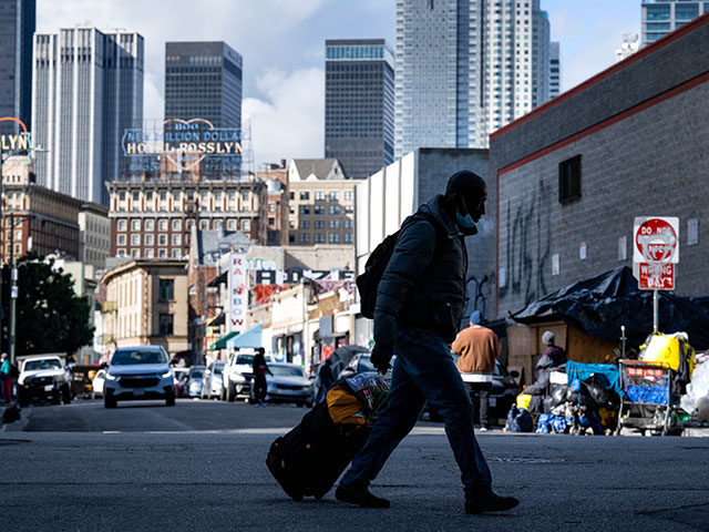 A homeless man walks through Los Angeles skid row on Monday, December 12, 2022. LA Mayor K
