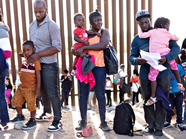 YUMA, ARIZONA- MAY 20: Immigrants from Haiti, who crossed through a gap in the U.S.-Mexico