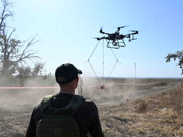 An operator of the volunteer organization 'Postup' controls the flight of an UAV carrying