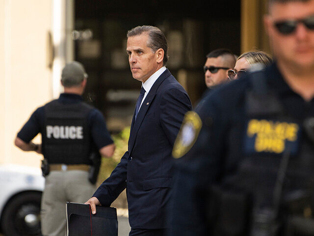 Hunter Biden, son of US President Joe Biden, center, exits federal court in Wilmington, De