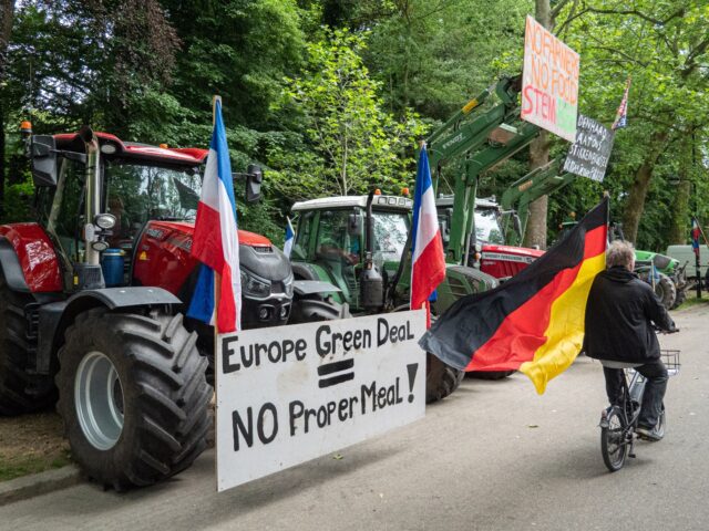 BRUSSELS, BELGIUM - JUNE 4: Farmer passes in front of tractors with the German flag. on Ju