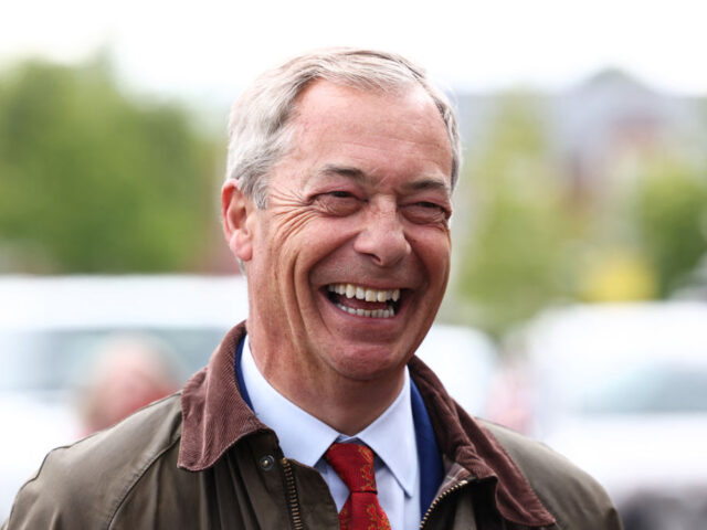 Leader of Reform UK Nigel Farage smiles during a visit to Ashfield in north England, on Ju