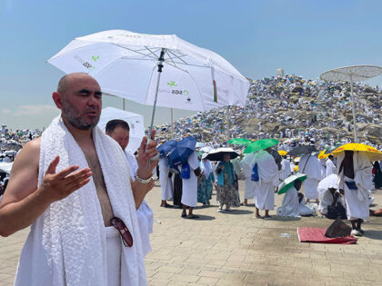 Prospective pilgrims pray at the Jabal ar-Rahmah in Arafat as Muslims continue their worsh