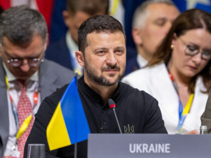 Ukrainian President Volodymyr Zelensky takes part in the opening plenary session of the Su