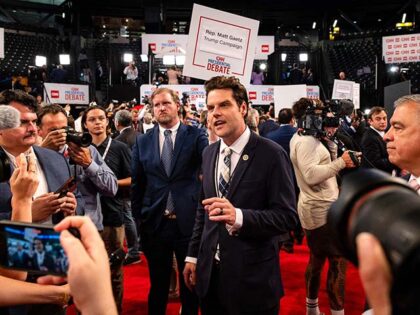 Representative Matt Gaetz, a Republican from Florida, center, speaks to members of the med