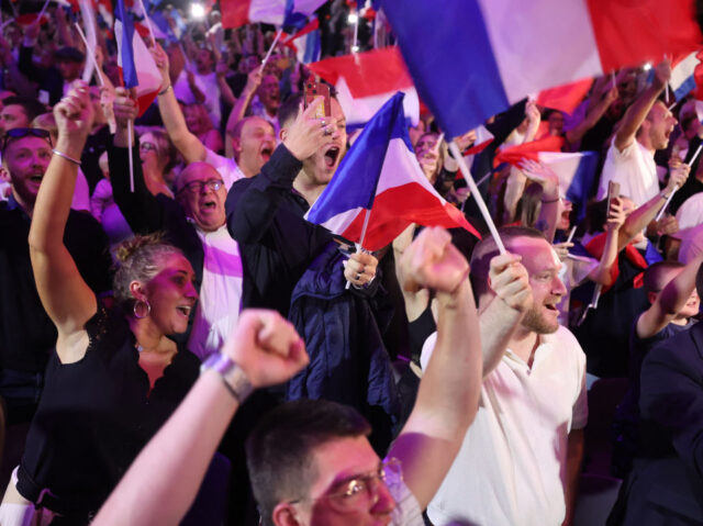Supporters react as former president of the French far-right Rassemblement National (RN) p