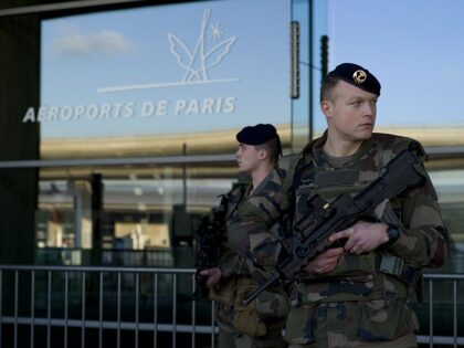 French soldiers patrol at the Charles de Gaulle airport on January 17, 2015 in Roissy-en-F