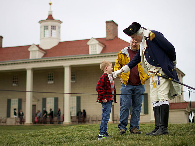 Dean Malissa (R) portrays President George Washington as he talks with vistors at the Moun