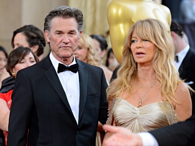 Kurt Russell, left, and Goldie Hawn arrive at the Oscars on Sunday, March 2, 2014, at the