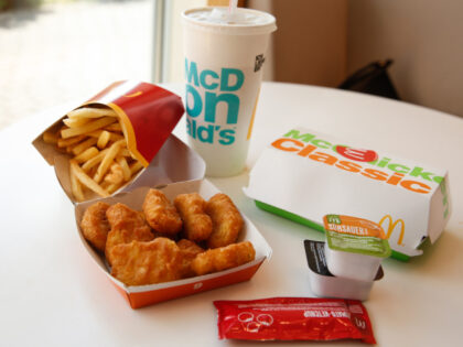 28 June 2019, Berlin: A cardboard box with Chicken McNuggets, McChicken Burger, a beverage