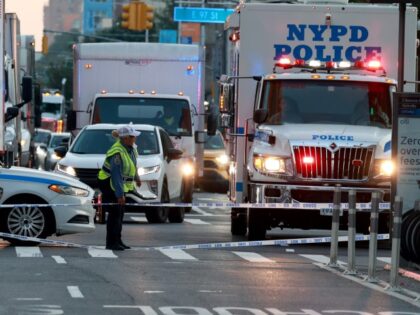 NYPD Highway Patrol Officers and Detectives are seen investigating an accident between a b