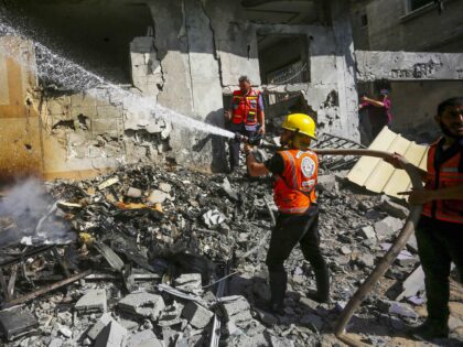 DEIR AL BALAH, GAZA - JUNE 08: Civil defense teams try to extinguish the fire that broke o