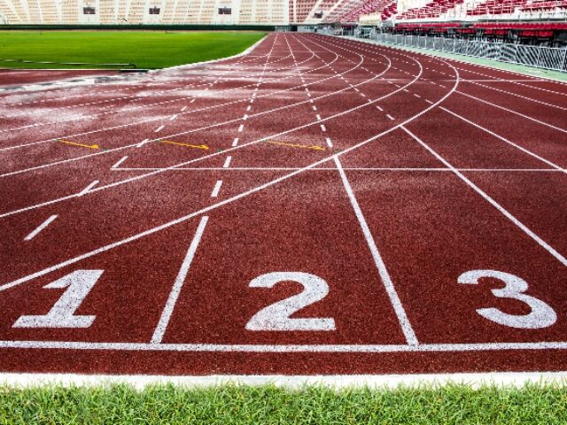 Red running track in The National Stadium of Thailand or Suphachalasai Stadium, Bangkok.