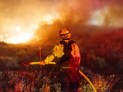 A firefighter monitors the Post Fire near Gorman, California, US, on Sunday, June 16, 2024