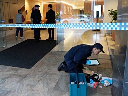 Police investigate vandalism at the U.S. consulate in Sydney, Monday, June 10, 2024. A sus