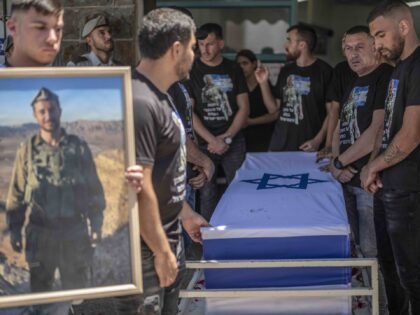 16 June 2024, Israel, Beit Jann: Friends and family mourn during the funeral of Israeli so