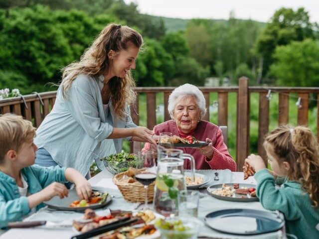 Woman serving her family a meal