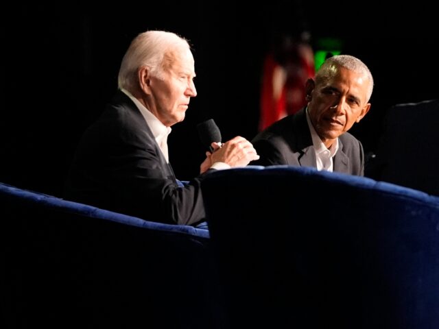 President Joe Biden speaks during a campaign event with former President Barack Obama mode