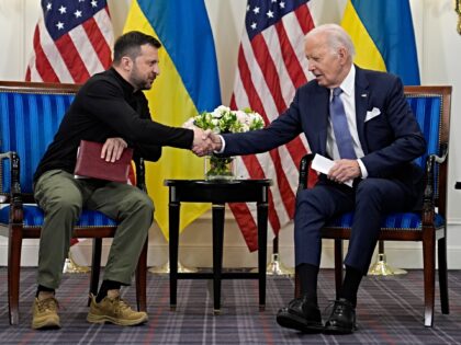 U.S. President Joe Biden shakes hands with Ukrainian President Volodymyr Zelenskyy in Pari