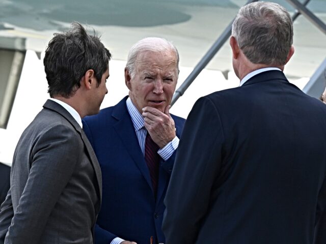 President Joe Biden is welcomed by French Prime Minister Gabriel Attal, left, upon his arr