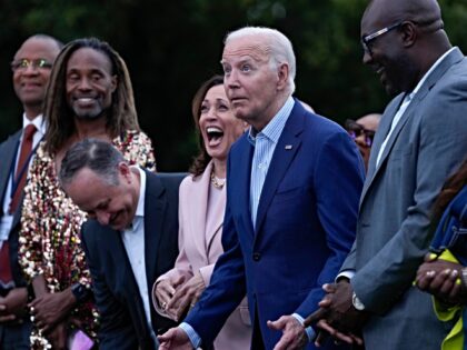President Joe Biden reacts to emcee comedian and actor Roy Wood, Jr. during a Juneteenth c