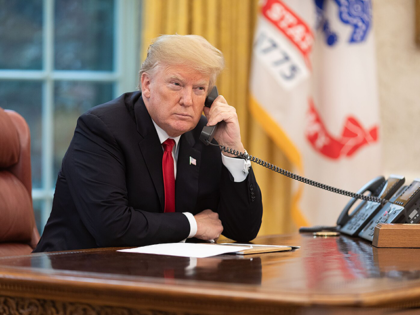 President Donald J. Trump speaks on the phone in the Oval Office Wednesday, Nov. 14, 2018,