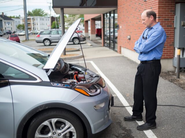 PORTLAND, ME - MAY 23: Perry Woods looks under the hood of the Chevy Volt at the Greater P