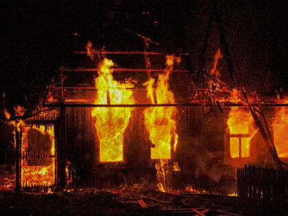 Burning house at night