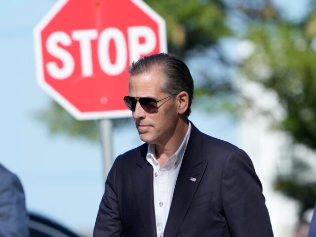 Hunter Biden, center, leaves St. Edmond Catholic Church in Rehoboth Beach, Del., Saturday,