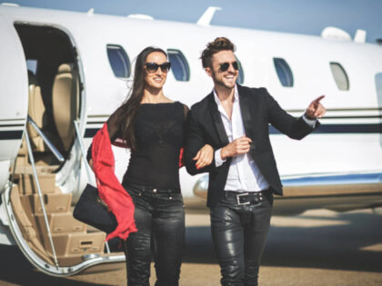 Passangers leaving private jet airplane - stock photo