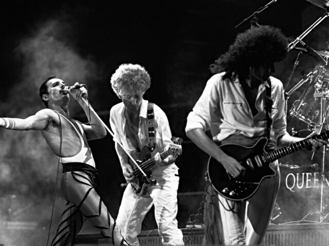 The rock band Queen in concert in 1984. (L to r) lead singer Freddie Mercury, John Deacon