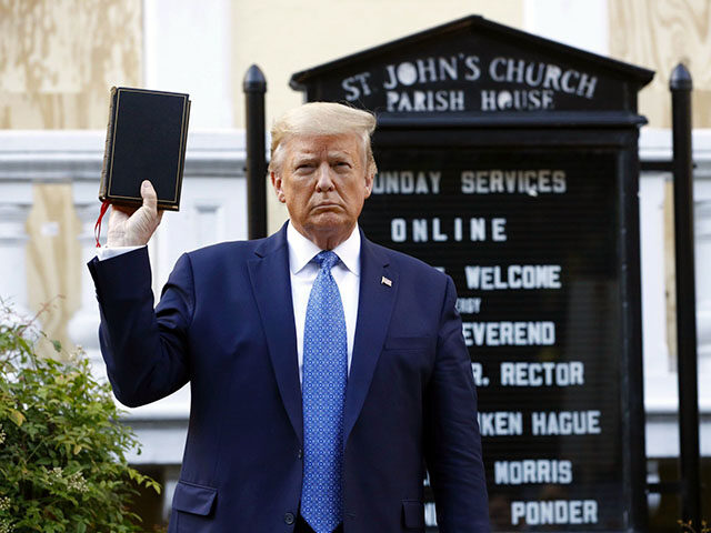 President Donald Trump holds a Bible as he visits outside St. John's Church, June 1, 2020,